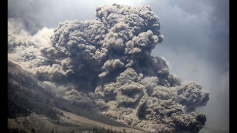 Mount Sinabung releases ash into the sky during an eruption as seen from Payung village in North Sumatra, Indonesia, on Monday, February 3. Sinabung erupted in 2010 and has been emitting gas since September.