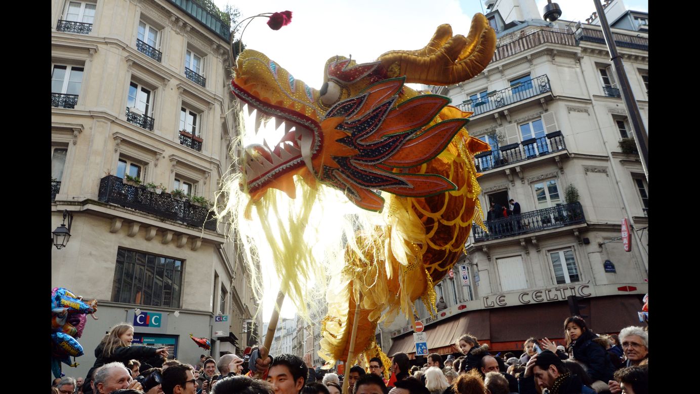 People gather in the streets of Paris to celebrate Lunar New Year on February 2.