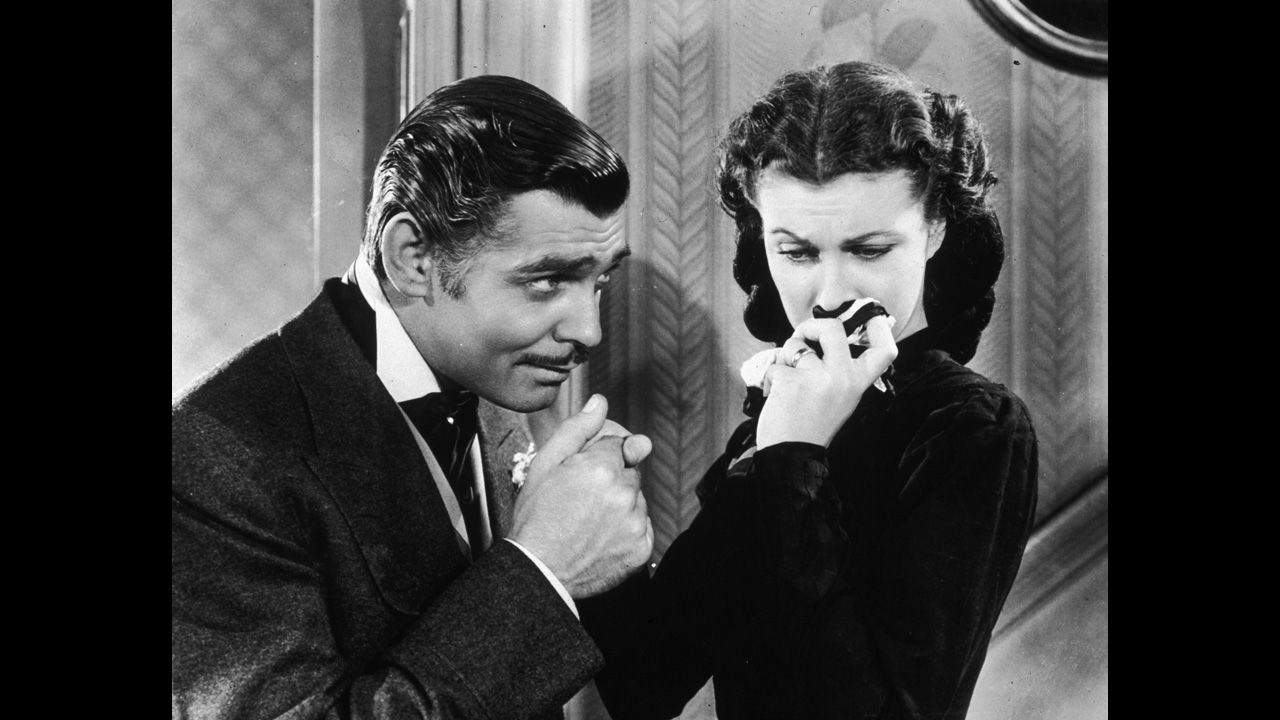 <strong>"Gone with the Wind":</strong> The first true Hollywood blockbuster, the 1939 film remains the most popular movie of all time when adjusted for inflation. Moviegoers swooned over the turbulent romance between roguish Rhett Butler (Clark Gable) and spoiled Scarlett O'Hara (Vivien Leigh), set in Georgia against the backdrop of the Civil War. 