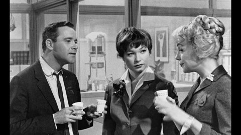 <strong>"The Apartment" (1961):</strong> Long before "Mad Men," Billy Wilder's "The Apartment" skewered corporate life of the early 1960s. Up-and-comer Jack Lemmon stays busy loaning his apartment key to company men who need a place to cheat on their wives. He falls for Shirley MacLaine, center, who is having an affair with one of the bosses ("My Three Sons' " Fred MacMurray in an unsympathetic role).