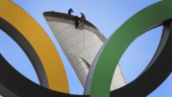 Workers check the Olympic cauldron at the Olympic Park's medals plaza in the seaside cluster prior to the start of the 2014 Sochi Winter Olympics on February 2, 2014 in Sochi. 