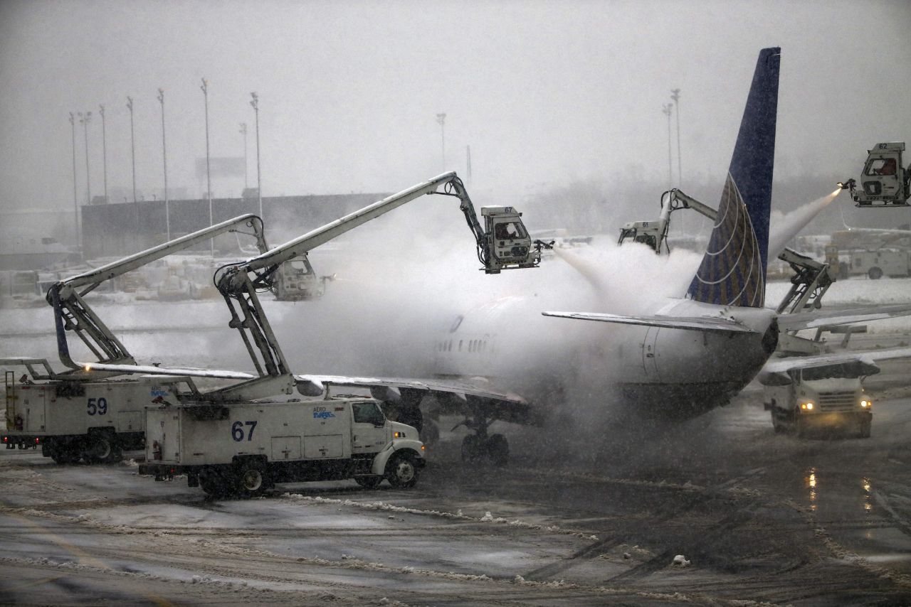A United Airlines jet is de-iced before taking off from New Jersey's Newark Liberty International Airport on Monday, February 3.