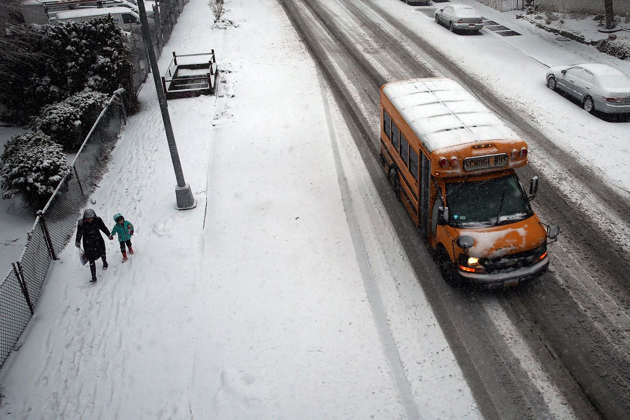 A school bus drives down the street during a snowstorm in Brooklyn, New York, on February 3.