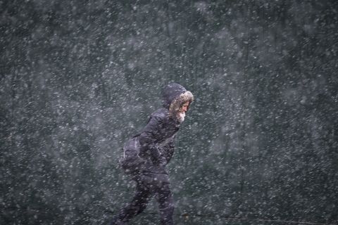 A pedestrian walks against the snow and wind on 42nd Street in New York on February 3.