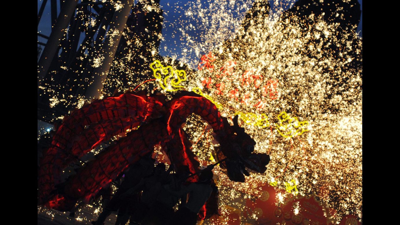 Fireworks explode around a dragon puppet during a performance in Beijing on February 3.
