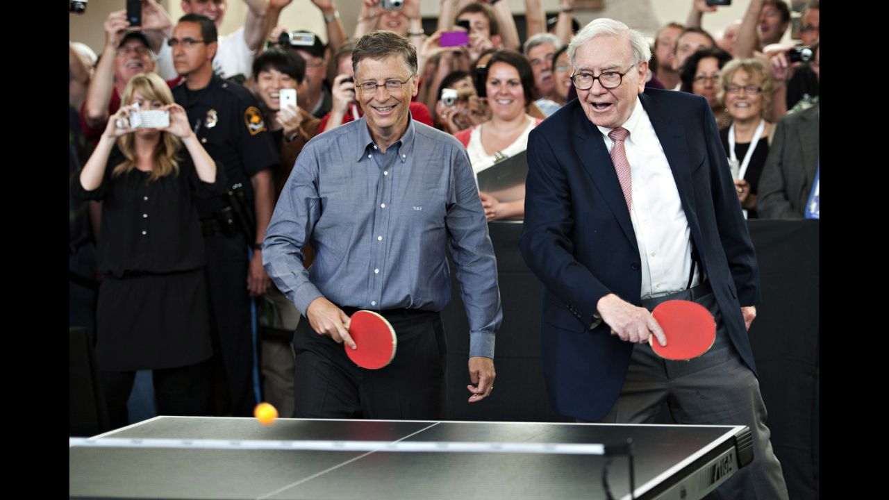 Gates, left, and Warren Buffett, chairman of Berkshire Hathaway, play table tennis during an event at the Berkshire Hathaway shareholders meeting in Omaha, Nebraska, on May 6, 2012. 