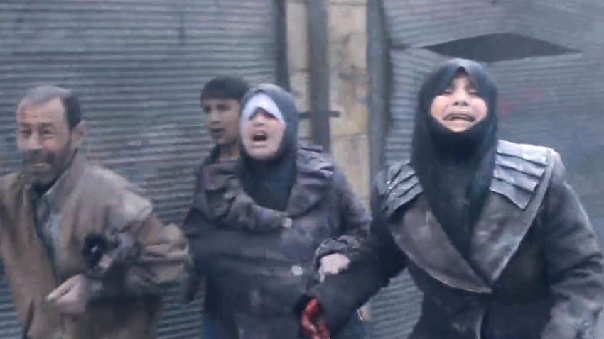 Women wail in agony after an alleged barrel bomb dropped by Syrian forces lands in Aleppo.