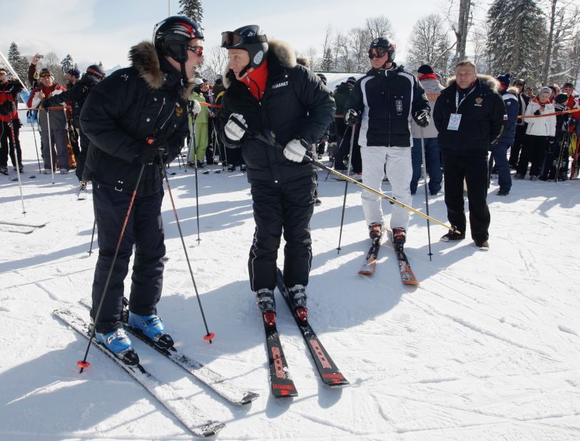 Russian President Vladimir Putin (center, with Prime Minister Dmitry Medvedev) is a regular skier in Sochi. Could he be tempted to go down the slopes during the Winter Olympics?