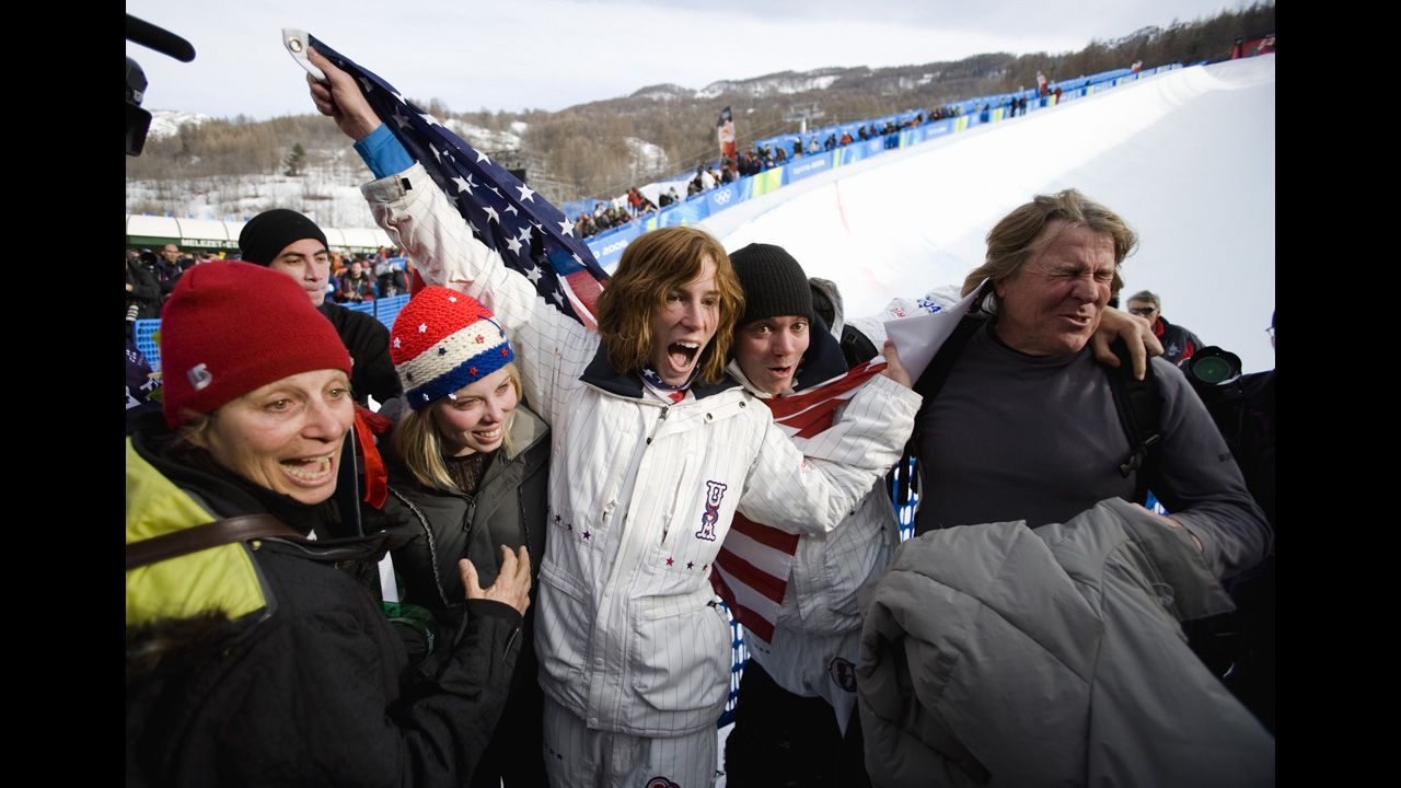 U.S. snowboarder Shaun White is surrounded by his family after winning gold during the 2006 Olympic Games in Italy. From left is his mother, Cathy; his sister, Kari; his brother, Jesse; and his father, Roger.