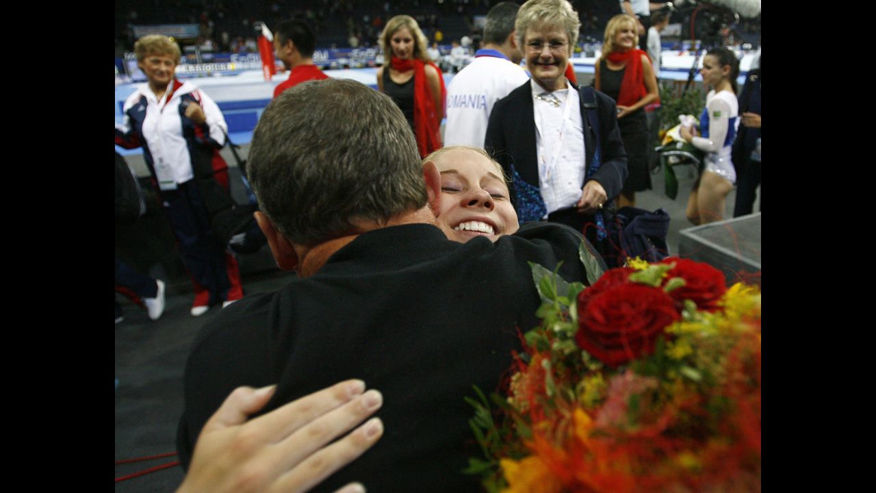 Gymnast Shawn Johnson celebrates with her father, Doug, after the United States won the women's team final at the World Artistic Gymnastics Championships in Germany in 2007.