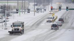 A salt truck clears the road eastbound along Broadway in Columbia, Missouri, on February 4.