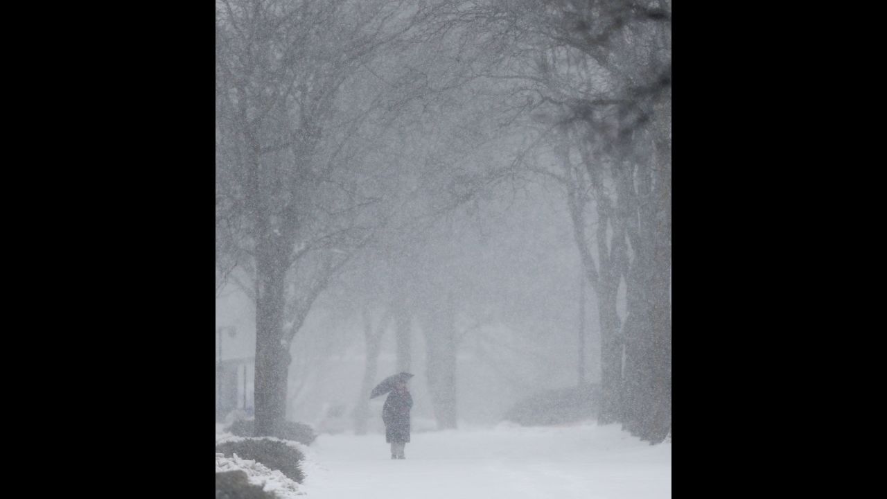 A woman makes her way through the snow on the University of Kansas campus in Lawrence on February 4.