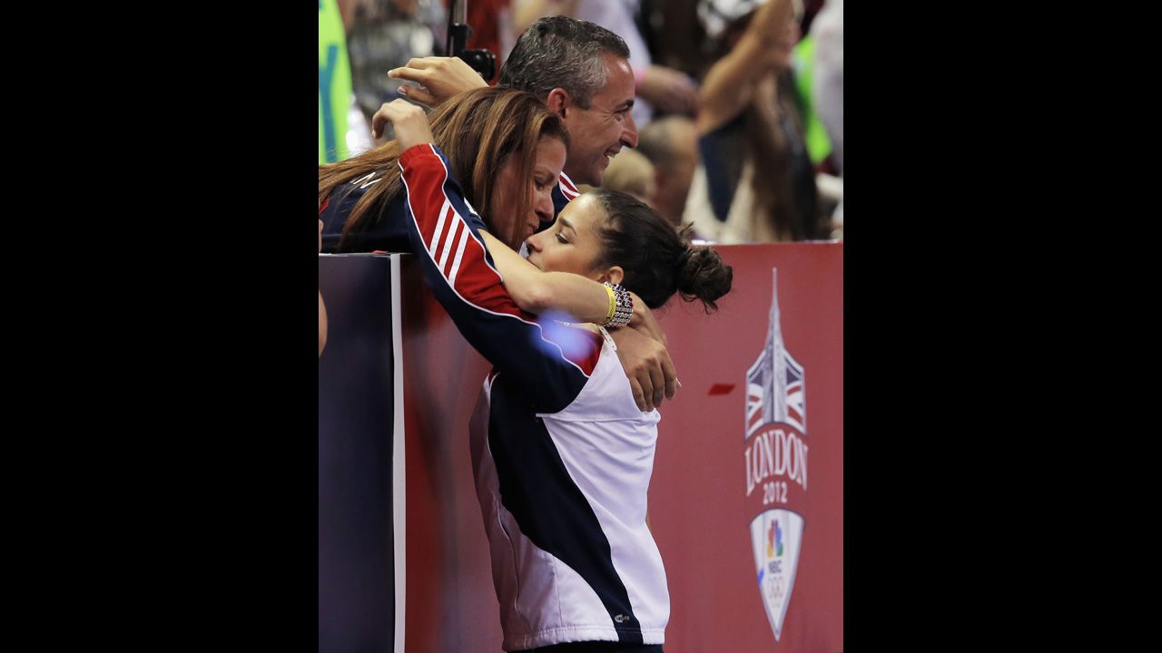 U.S. gymnast Aly Raisman gets a hug from her parents, Rick and Lynn, after being named to the Olympic team in 2012.