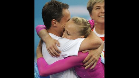 American gymnast Nastia Liukin celebrates with her father and coach, Valeri, after winning gold in the individual all-around at the Olympics in 2008.