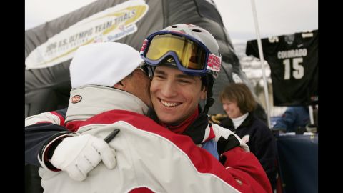 Skier Jeremy Bloom gets a hug from his father, Larry, after earning a spot on the U.S. Olympic team in 2005.