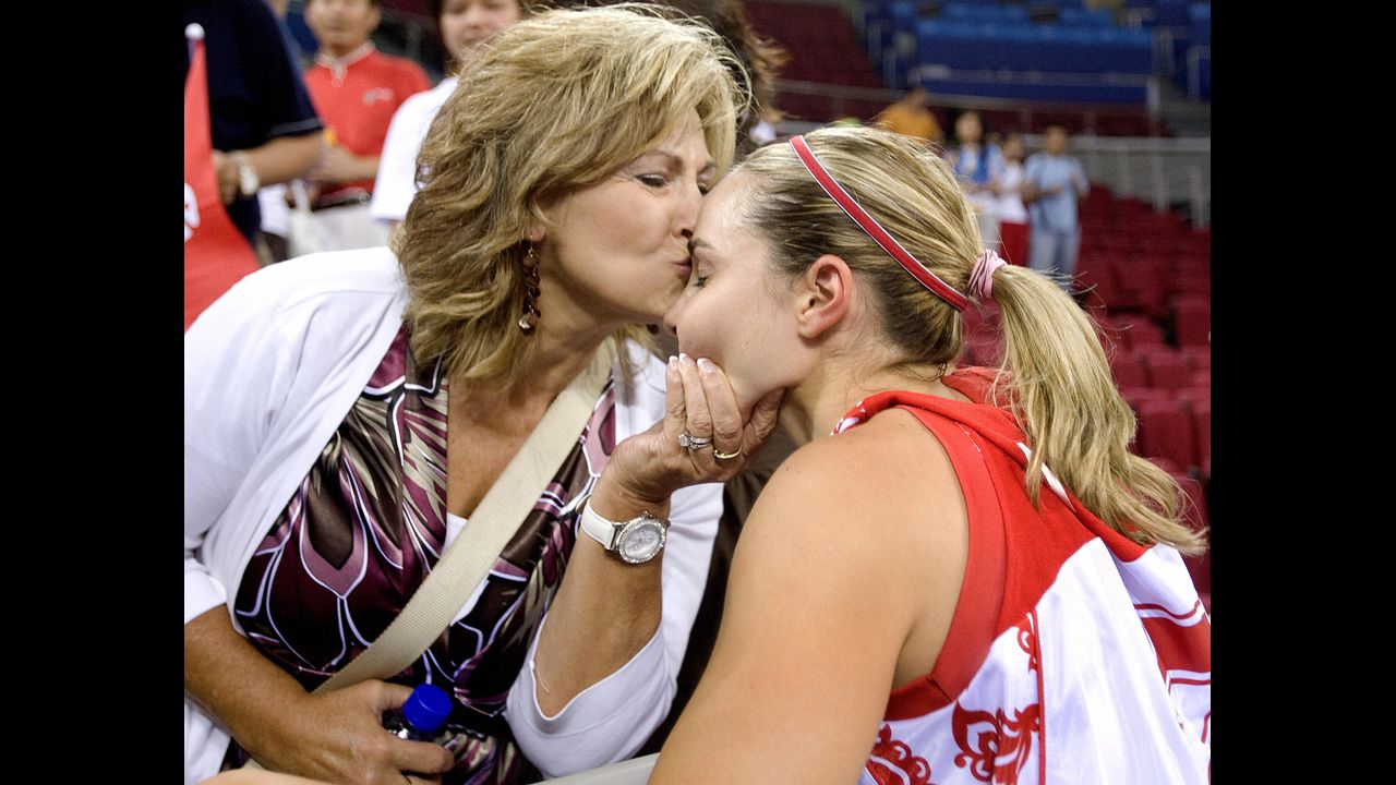Basketball player Becky Hammon receives a kiss from her mother, Bev, at the 2008 Olympic Games. Hammon played for Russia.