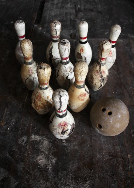 These bowling pins and ball were set for a match in the gymnasium of an abandoned Cleveland area school. 