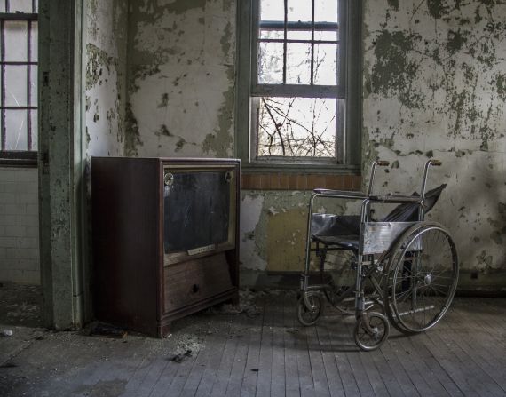 "The dust on the TV and wheelchair shows how untouched parts of the hospital are and will remain," Kina said. 