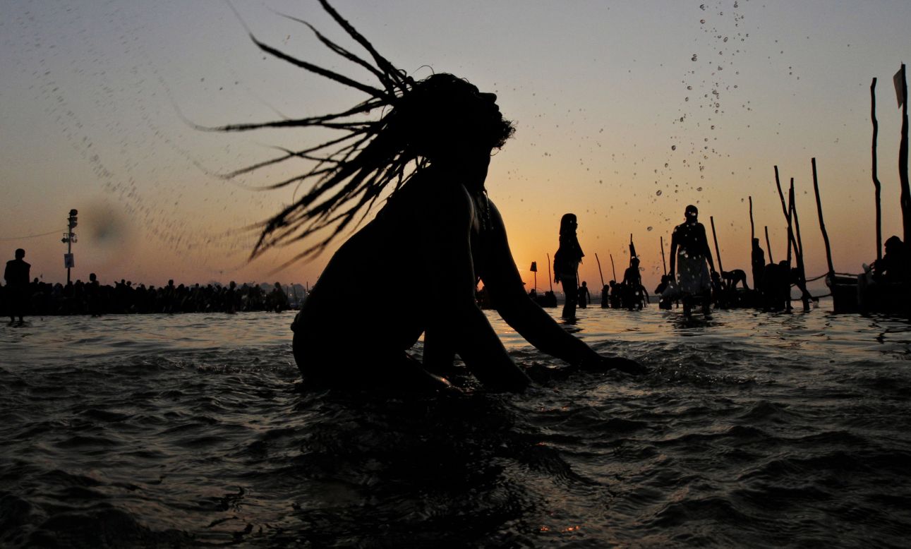 FEBRUARY 4 - ALLAHABAD, INDIA: A Naga sadhu, or Hindu holy naked man, takes a dip in the Sangam -- the confluence of the Ganges, Yamuna and mythical Saraswati rivers --  on the auspicious occasion of Basant Panchmi at the annual traditional fair of Magh Mela. The fifth day of spring is celebrated by worshiping Saraswati -- the Hindu goddess of knowledge and wisdom.