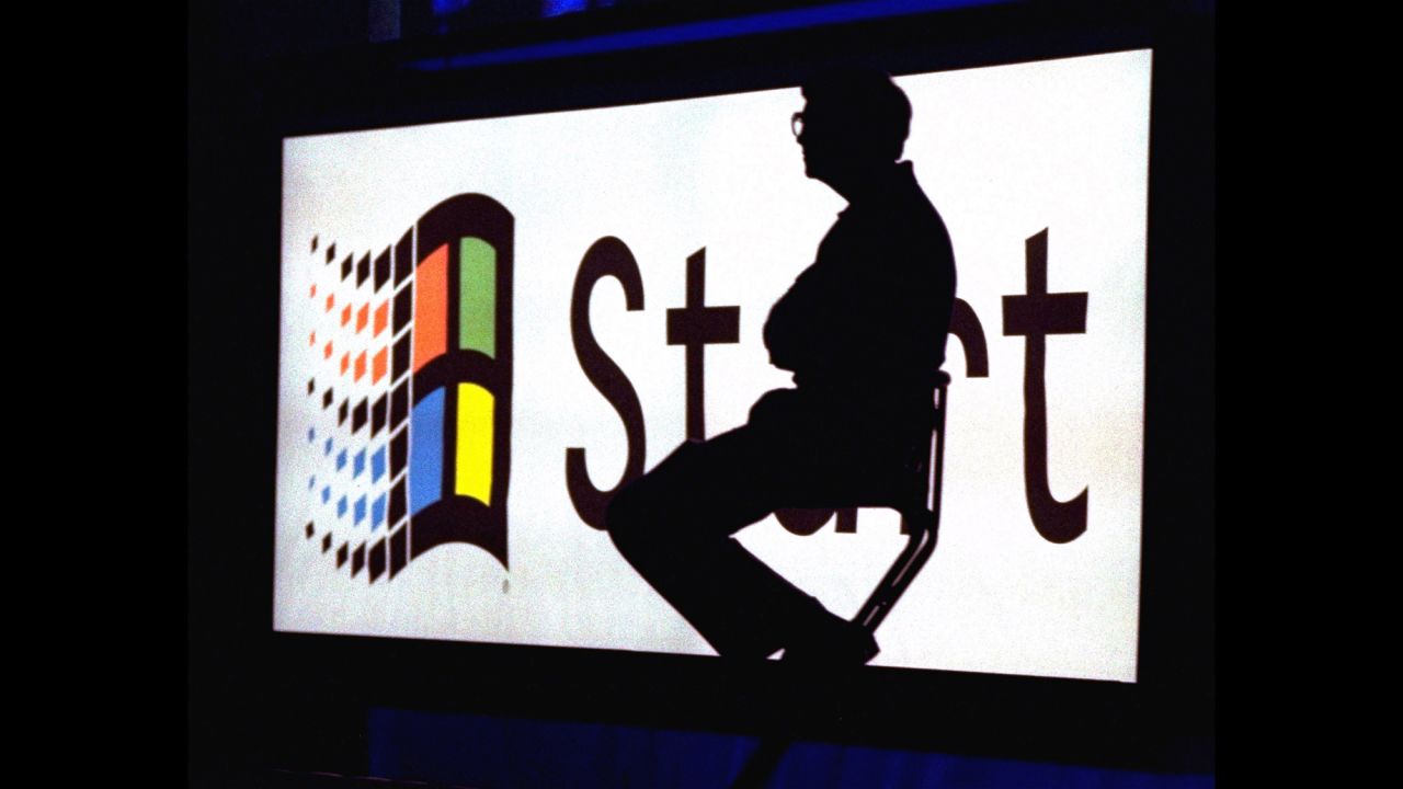 Gates sits on stage during a video portion of the Windows 95 launch event on August 24, 1995, on the company's campus in Redmond, Washington. A Harvard University dropout, Gates co-founded Microsoft with Paul Allen in 1975. 