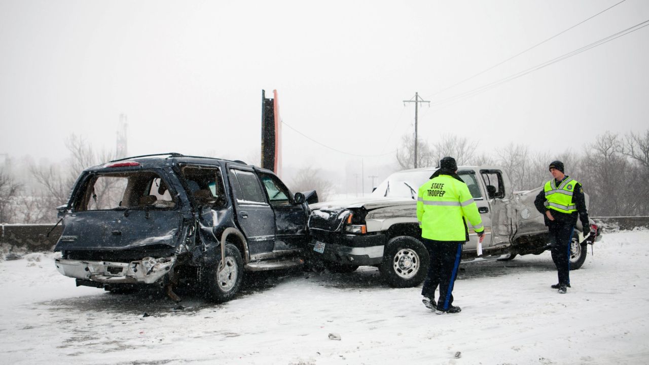 Law enforcement officials evaluate the scene of a crash on Interstate 29 in St. Joseph, Missouri, on Tuesday, February 4.