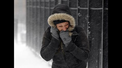 A woman fights the wind and snow in Chicago on February 5.