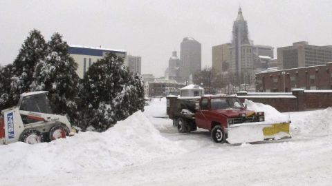 Crews clear snow as ice pellets fall in Hartford, Connecticut, on February 5.