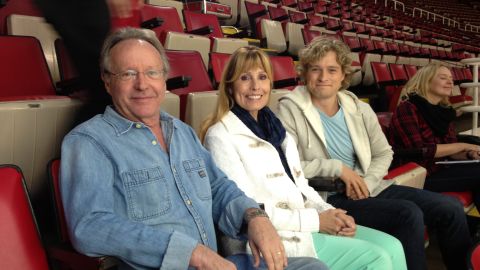 Ice dancer Charlie White sits with his parents, Charlie and Jacqui White.