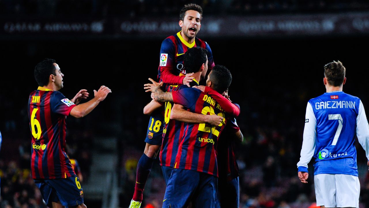 Sergio Busquets is mobbed after breaking the deadlock against Real Sociedad in Camp Nou on Wednesday. 