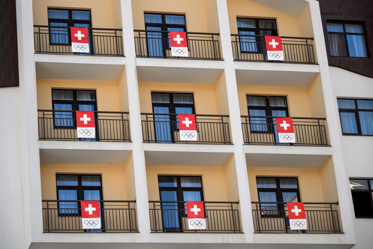Anybody is anybody sports a flag in the Olympic Village. Hats off to the Swiss for their effortless flag co-ordination.