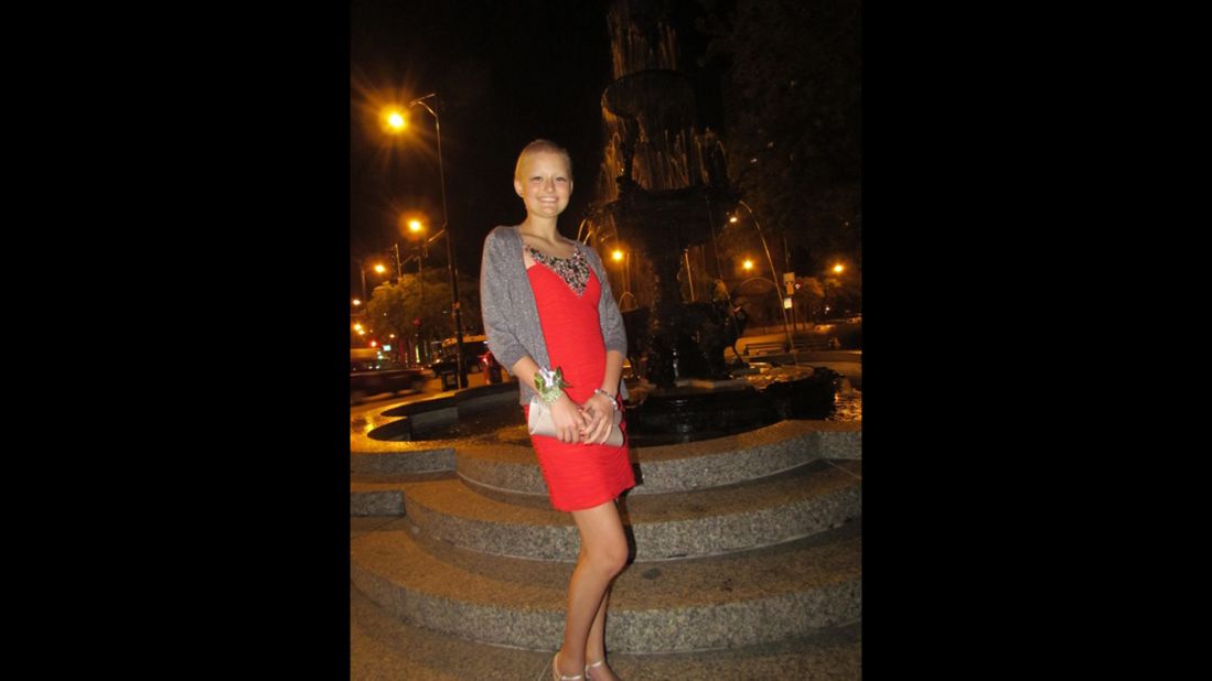 Daniela wears a bright red dress for her homecoming dance in September 2012. 
