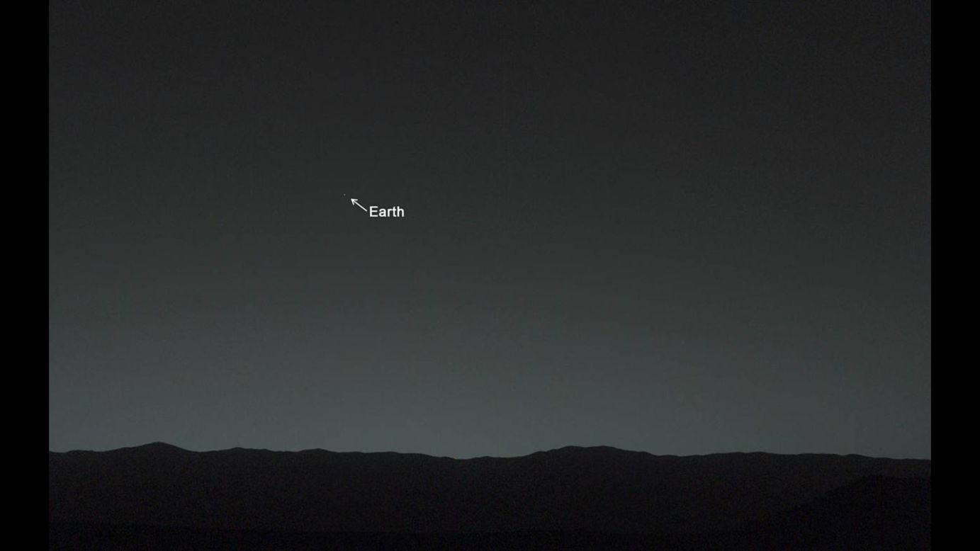 This view of the twilight sky and Martian horizon, taken by Curiosity, includes Earth as the brightest point of light in the night sky. Earth is a little left of center in the image, and our moon is just below Earth. A human observer with normal vision, if standing on Mars, could easily see Earth and the moon as two distinct, bright "evening stars."