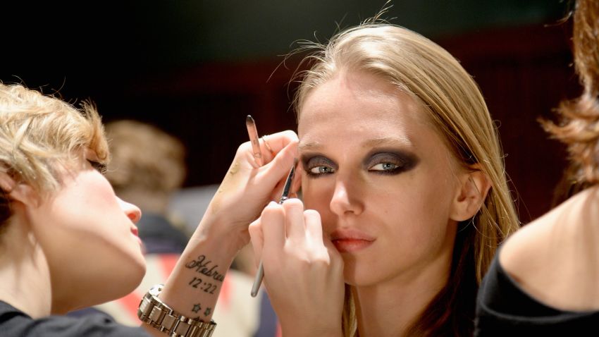 NEW YORK, NY - FEBRUARY 06: A model prepares backstage at Jay Godfrey Presentation during Mercedes-Benz Fashion Week Fall 2014 at The Hub at The Hudson Hotel on February 6, 2014 in New York City. (Photo by Fernanda Calfat/Getty Images For Mercedes-Benz Fashion Week)
