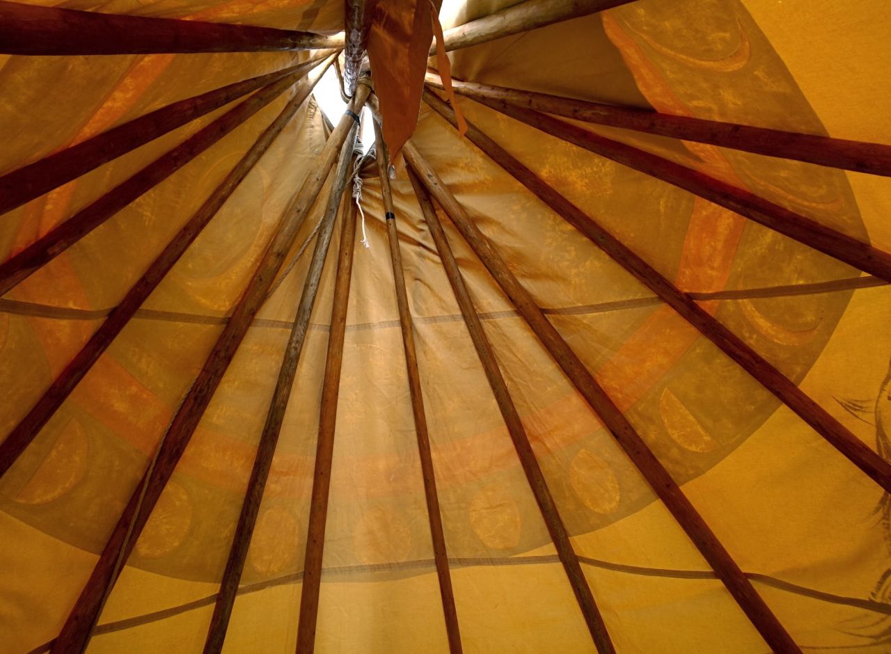 After helping to construct a teepee with a guest presenter who came to the school, a second-grade student took this picture to show the view from the inside.