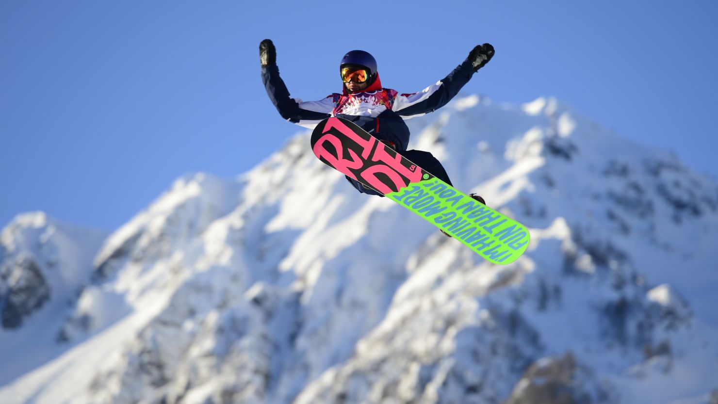 British snowboarder Billy Morgan flies high as the first athlete to compete in the 2014 Winter Olympics.