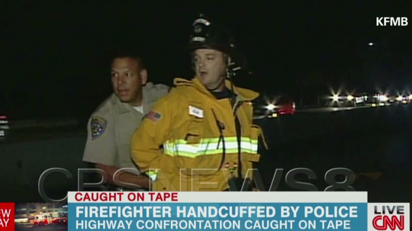 newday pkg elam firefighter handcuffed by police_00000913.jpg