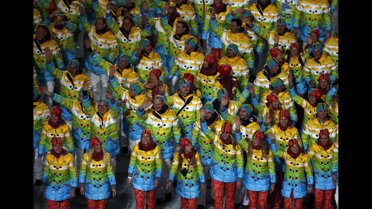 Members of the German delegation wave during the opening ceremony.