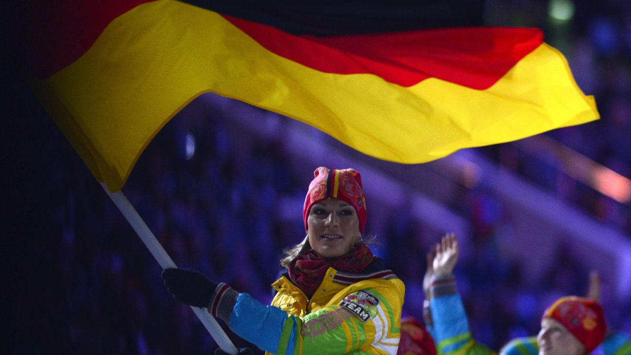 Germany's flag bearer, skier Maria Hoefl-Riesch, leads the German delegation.
