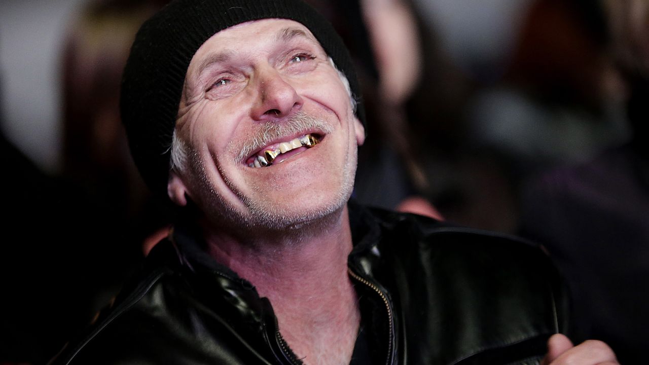 A man watches the live telecast of the opening ceremony in downtown Sochi.