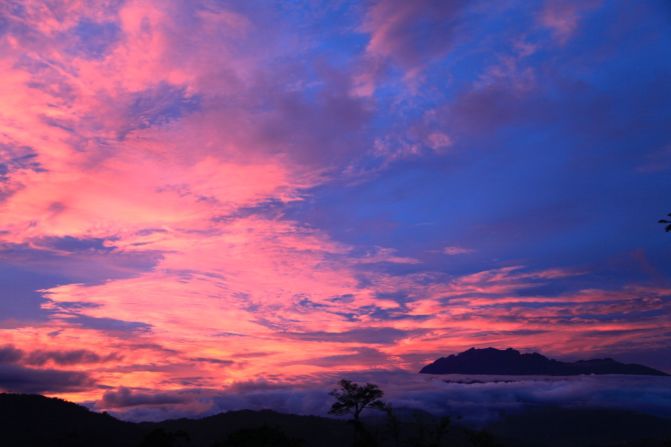 Sunrise colors change throughout the morning. These steaks overlook the Crocker Range, a mountainous spine with an average height of 1,800 meters that divides the west and east coasts of Sabah. 