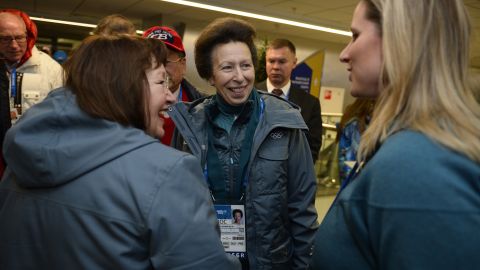 Britain's Princess Anne, center, talks with people upon arriving for the opening ceremony.