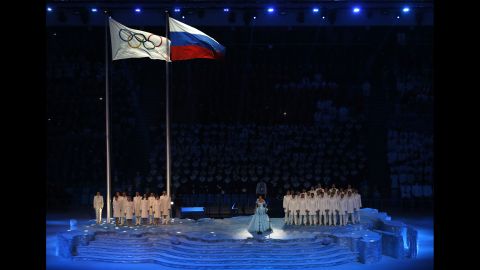 Russian soprano Anna Netrebko sings the Olympic Anthem.