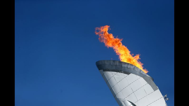 The Olympic flame burns.
