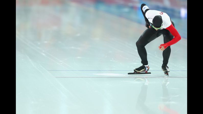 Mathieu Giroux of Canada prepares to compete during the men's 5,000-meter speedskating event.