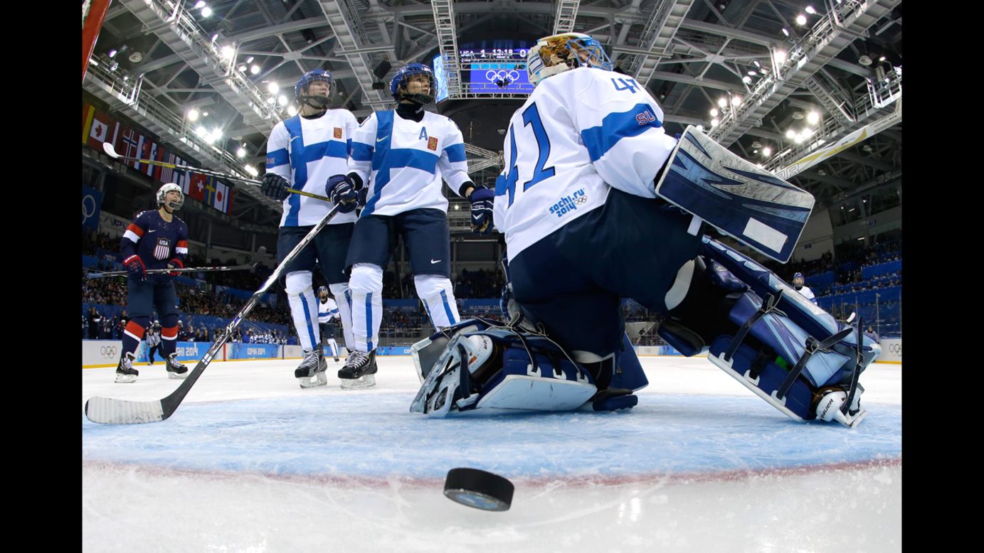 Finnish goalie Noora Raty allows a goal during a women's ice hockey game against the United States.