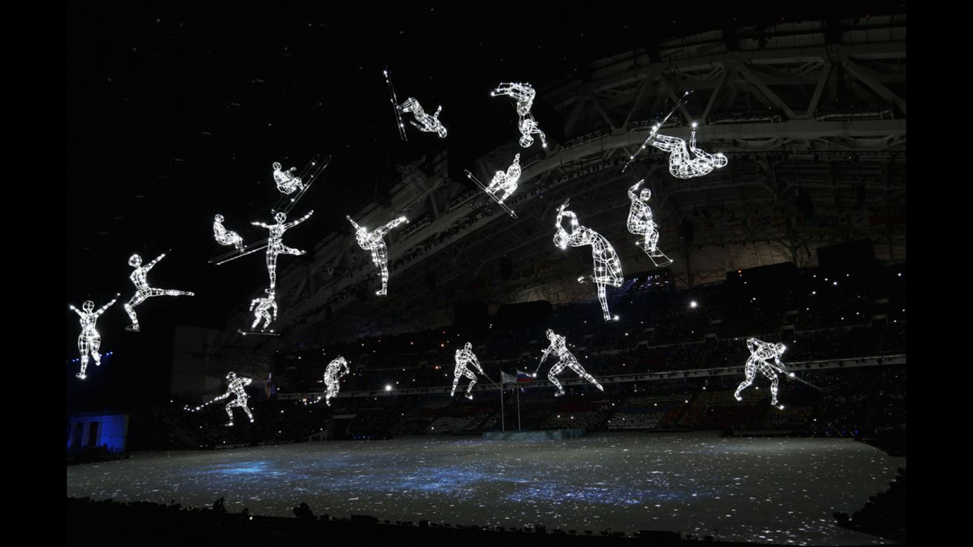 Olympic sports are depicted with lights during the opening ceremony.