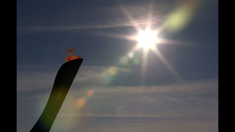 The Olympic flame burns February 8 at Olympic Park.