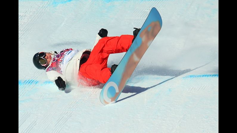 Snowboarder Lucien Koch of Switzerland falls during the men's slopestyle semifinals on February 9. 