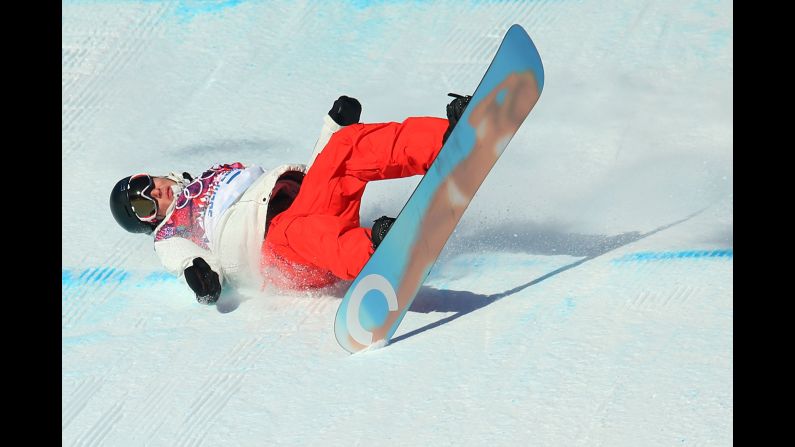 Snowboarder Lucien Koch of Switzerland falls during the men's slopestyle semifinals on February 9.