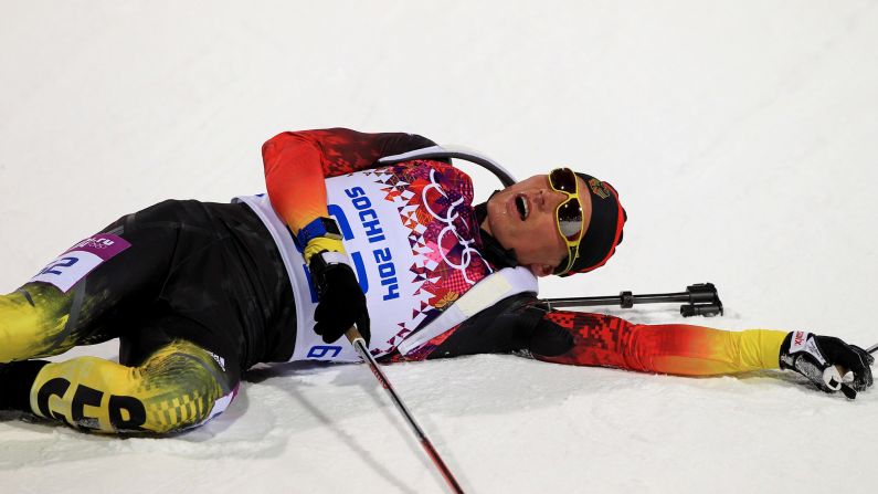 Tarjei Boe, a biathlete from Norway, falls to the ground after competing in the 10-kilometer sprint.